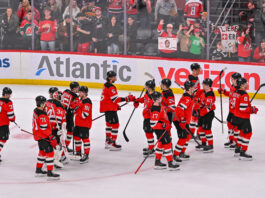 Hughes Explodes for Five Points As Devils Dominate Capitals 7-3