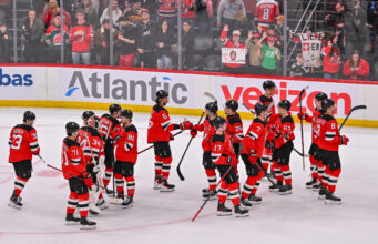 Hughes Explodes for Five Points As Devils Dominate Capitals 7-3