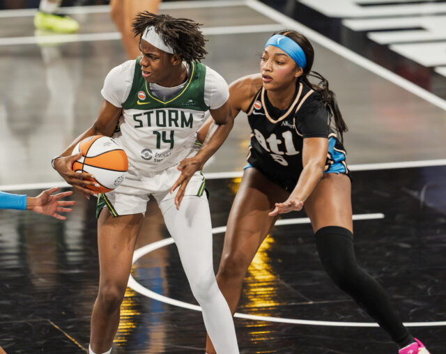 #14 Dominique Malonga posts up #5 Angel Reese