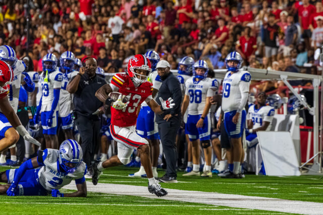 Chris Durr Jr. #13 TE of UMD sliding through a tackle