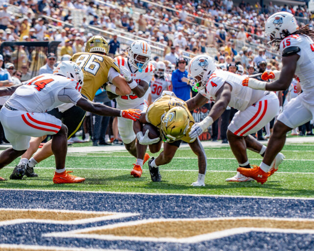 Malachi Hosley runs in for a towndown before he is ruled down just short of the goal line.-7180